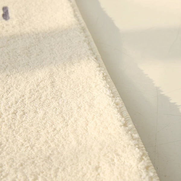 Tapis salon crème texturé moderne
